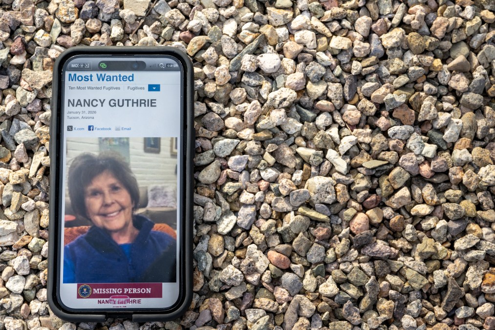 Nancy Guthrie's missing persons poster on a phone