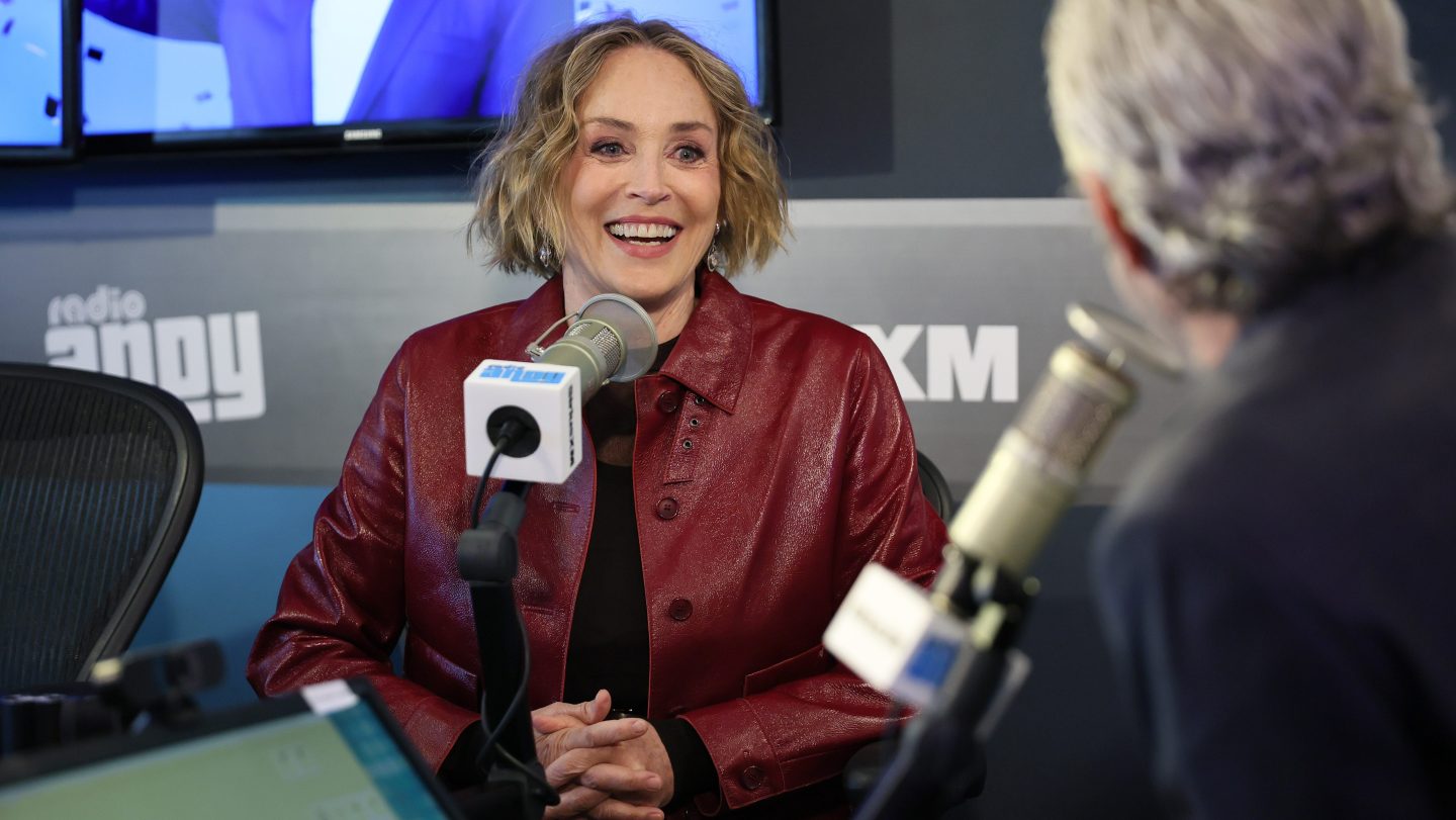 Andy Cohen (R) interviews Sharon Stone during her visit to SiriusXM Studios.