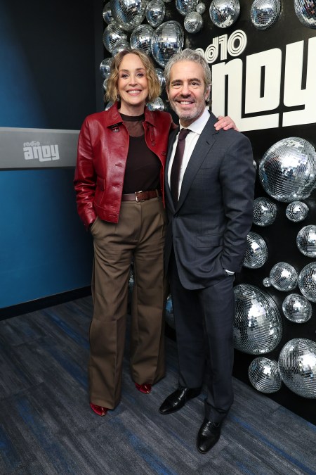Andy Cohen (R) poses with Sharon Stone during her visit to SiriusXM Studios.