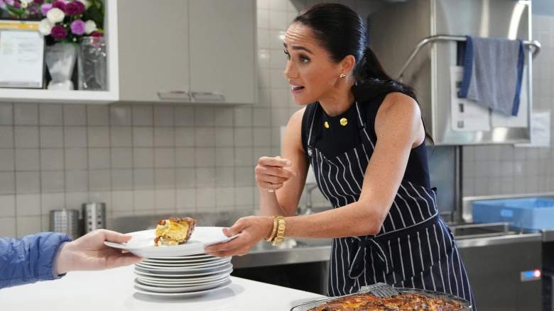 Meghan, the Duchess of Sussex, serves lunch to a resident during a visit at the McAuley Community Services for Women.