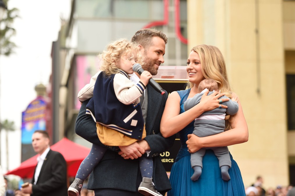 Actors Ryan Reynolds (L) and Blake Lively pose with their daughters 
