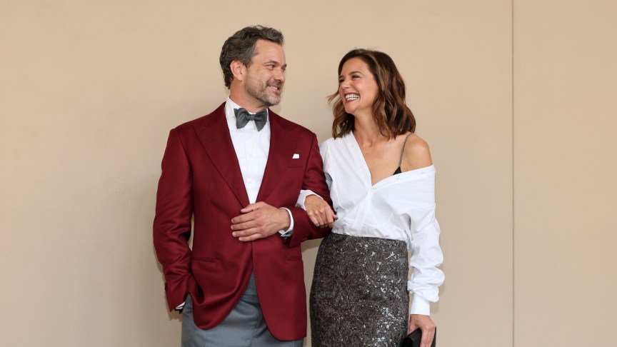 Joshua Jackson and Katie Holmes smiling at an event