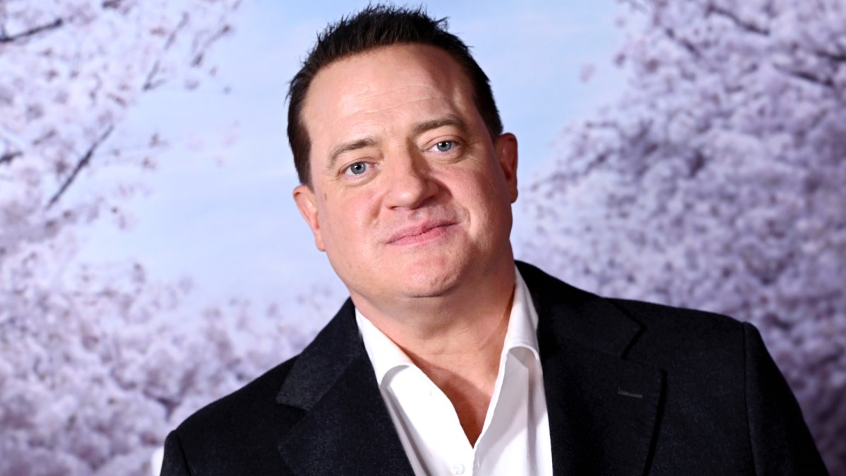 Brendan Fraser poses for photos at an event