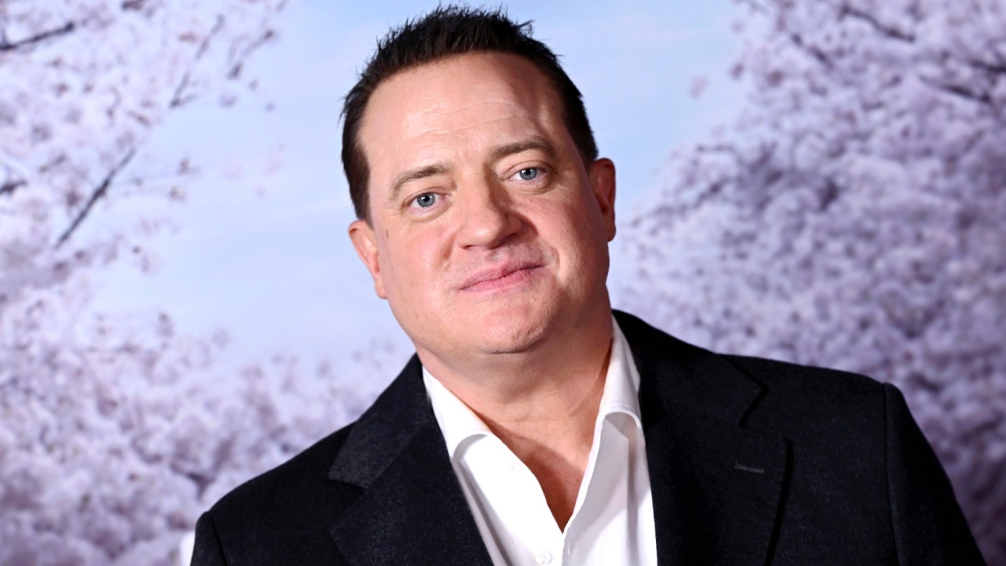 Brendan Fraser poses for photos at an event