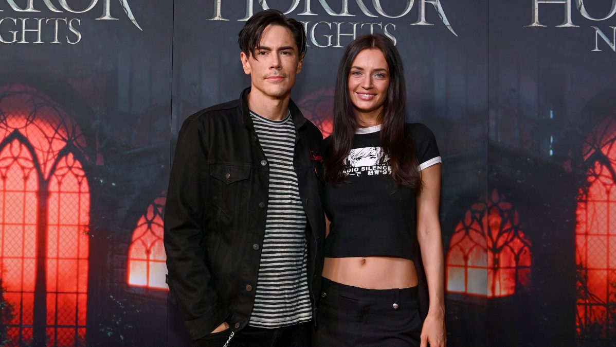 Tom Sandoval and Victoria Lee Robinson pose together at Halloween Horror Nights Opening Night in Hollywood.