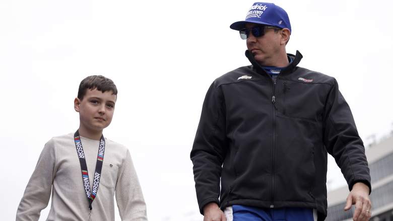 Kyle Busch walks with son Brexton Busch before a NASCAR Craftsman Truck Series race at EchoPark Speedway in February 2026.