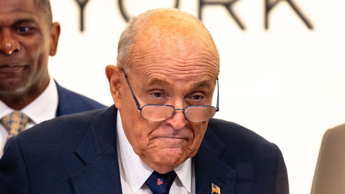Former New York City Mayor Rudy Giuliani accompanies Chris Ruddy, CEO of Newsmax, for the ringing the opening bell at the New York Stock Exchange during morning trading on April 03, 2025