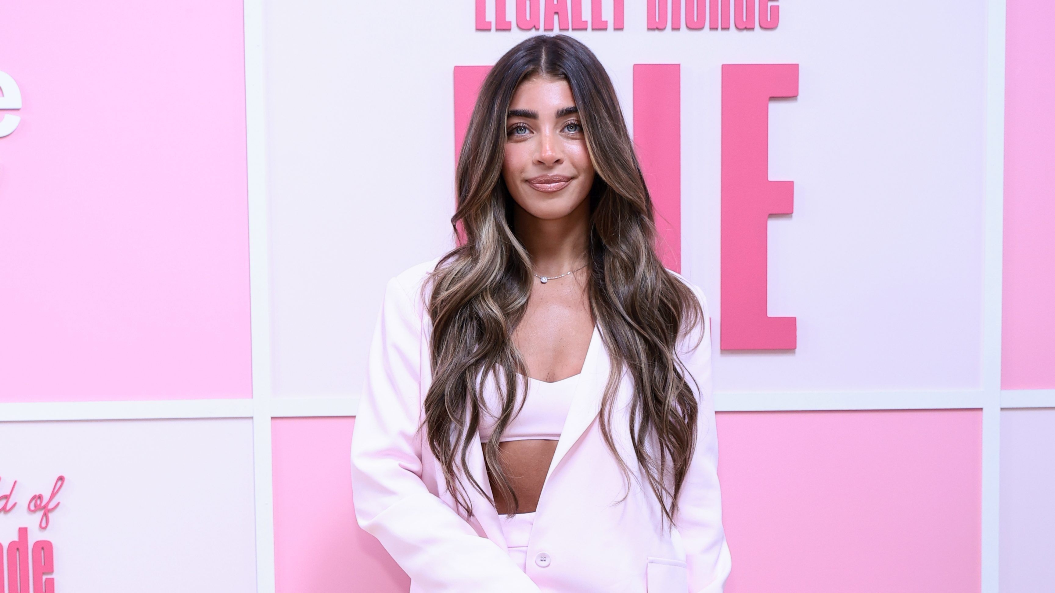Gia Giudice poses on the pink carpet at the "Elle" Season 1 world premiere in New York City.