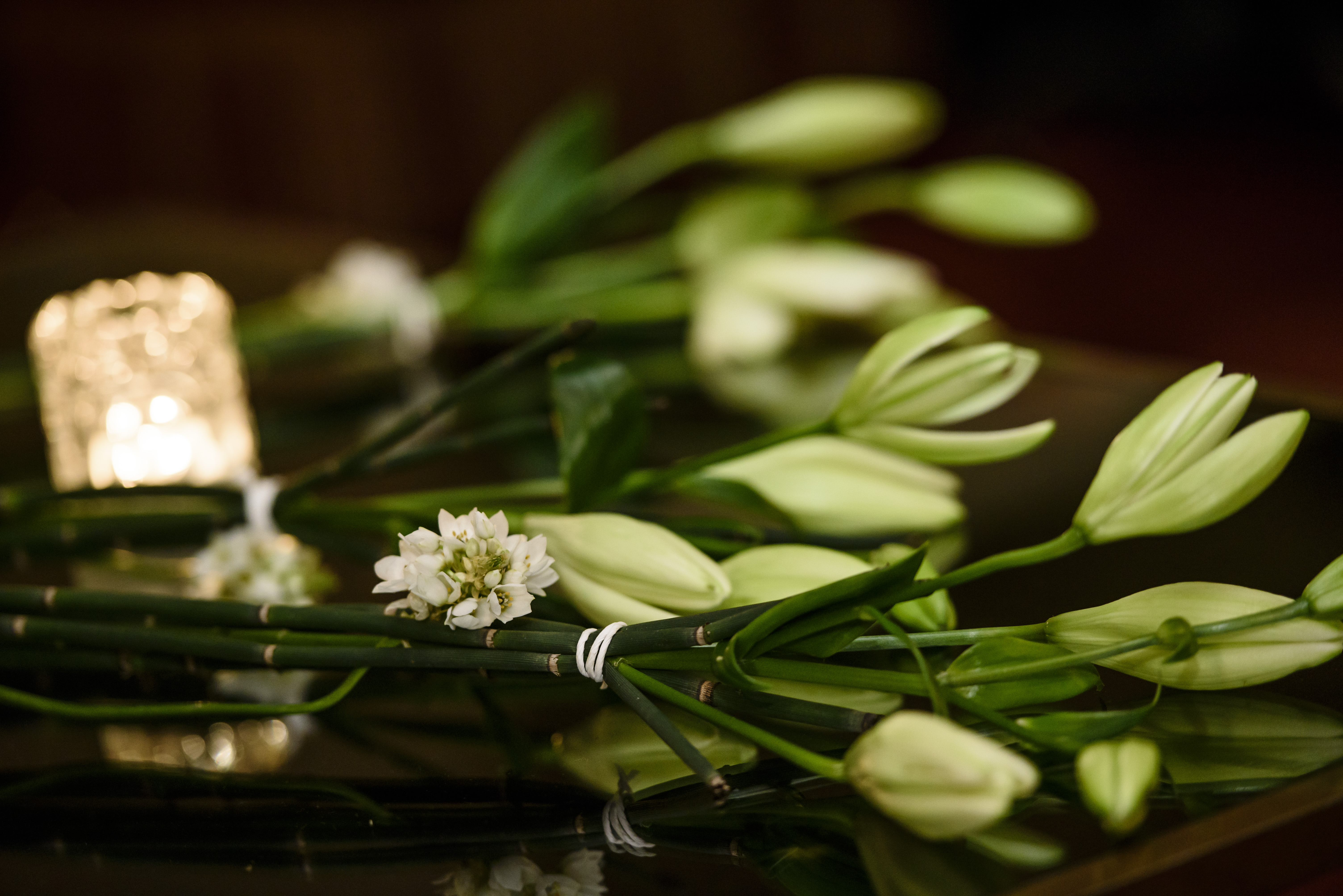 Flowers and candle for Dexter Wansel.