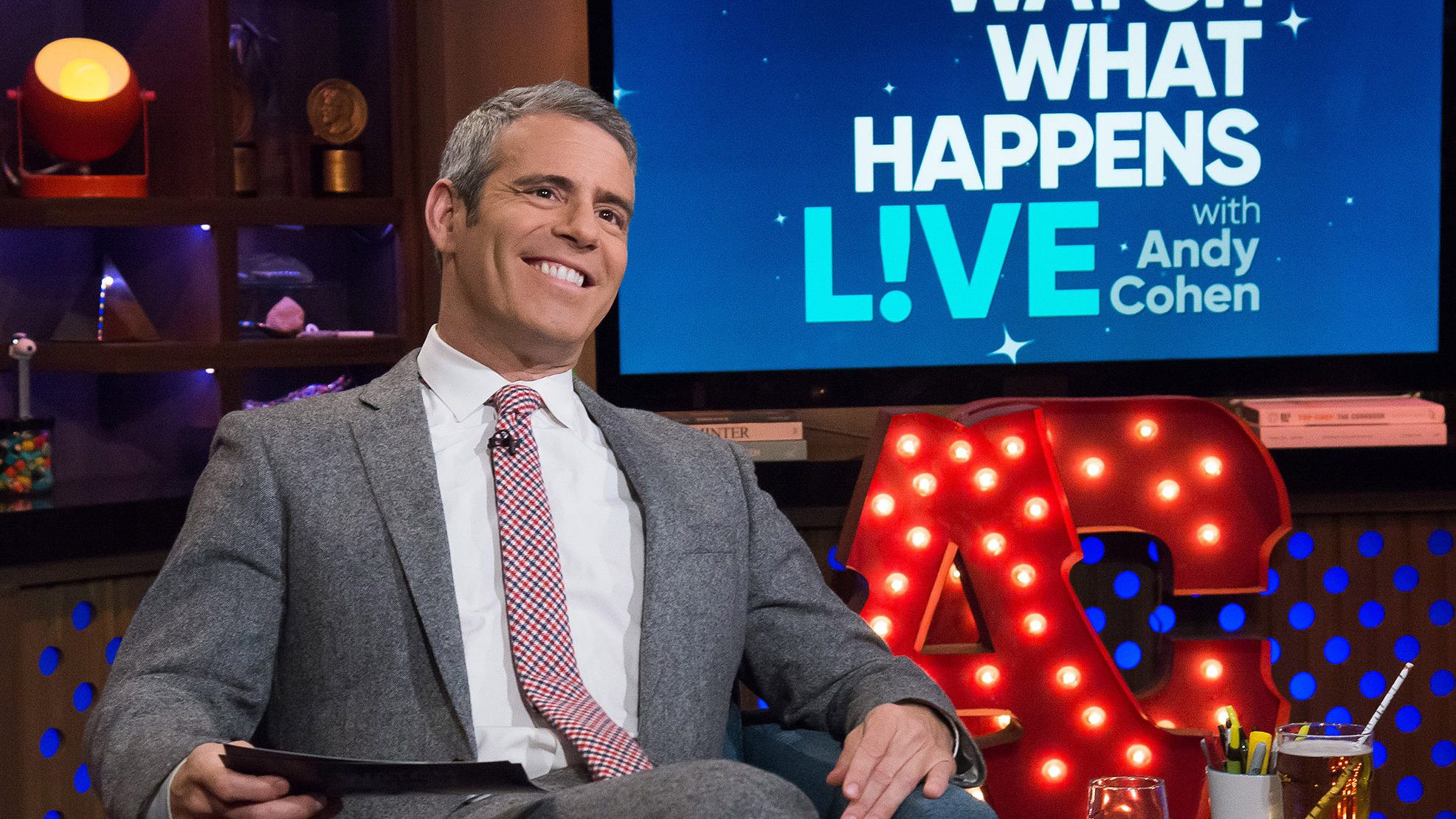 Andy Cohen smiles on the set of Watch What Happens Live with Andy Cohen.