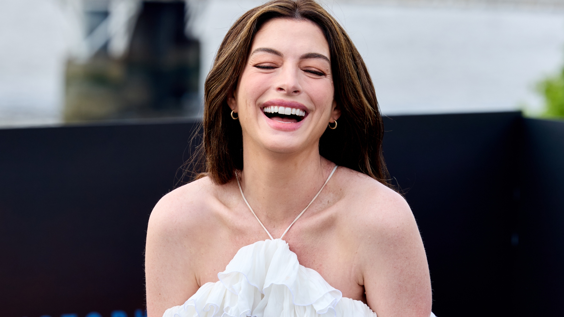 Anne Hathaway, 43, Looks Angelic in White Dress as She Cradles Her Baby Bump on the Red Carpet: PHOTOS