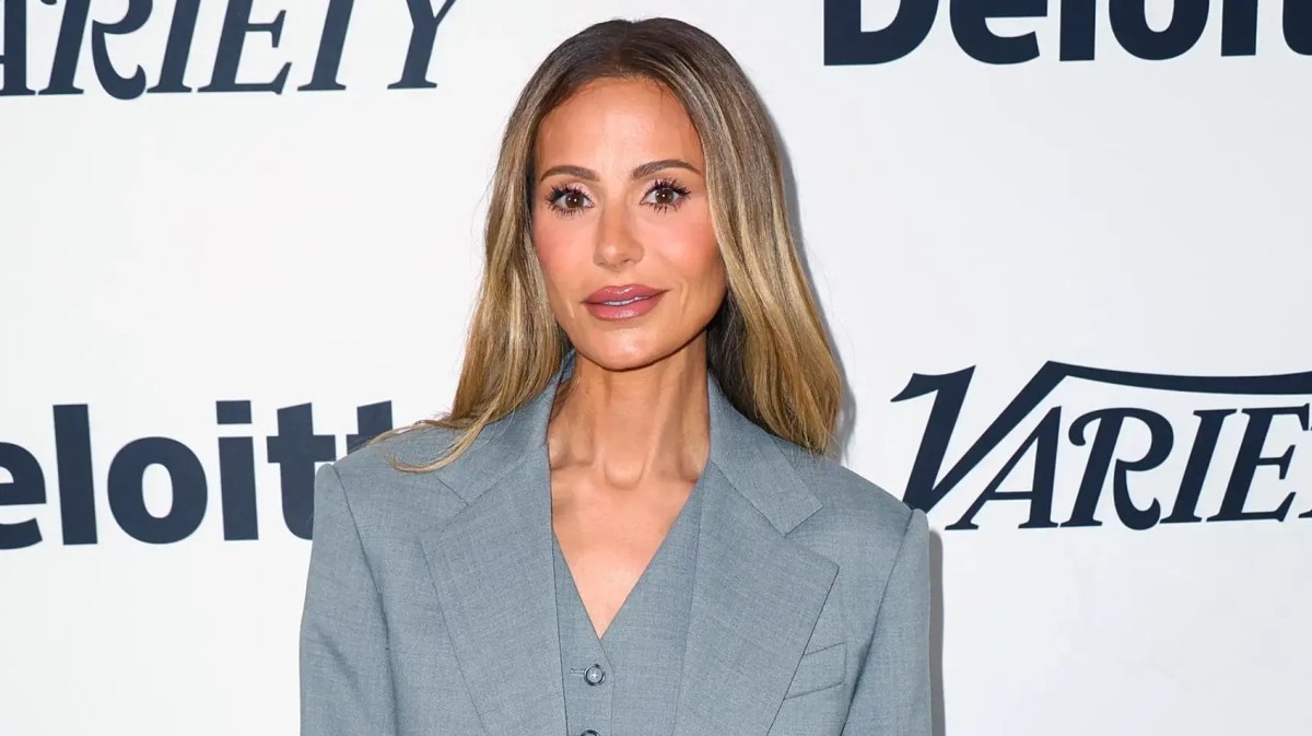 Dorit Kemsley poses in a champagne-colored dress amid news of a new foreclosure sale date for her Encino home.
