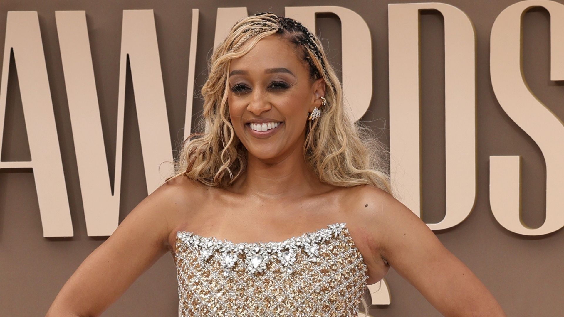Tia Mowry smiling on the BET Awards red carpet