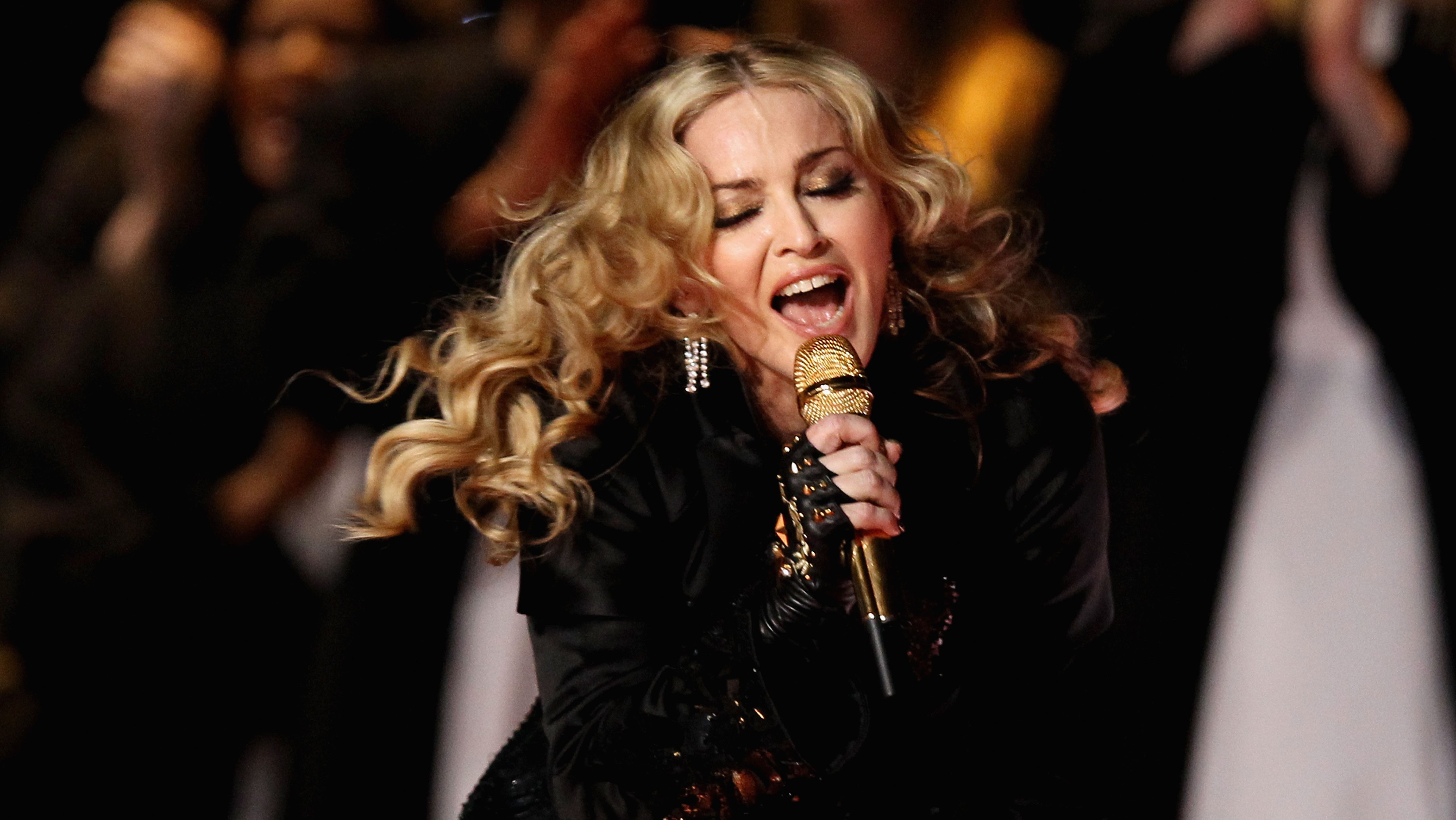 Singer Madonna performs during the Bridgestone Super Bowl XLVI Halftime Show at Lucas Oil Stadium.