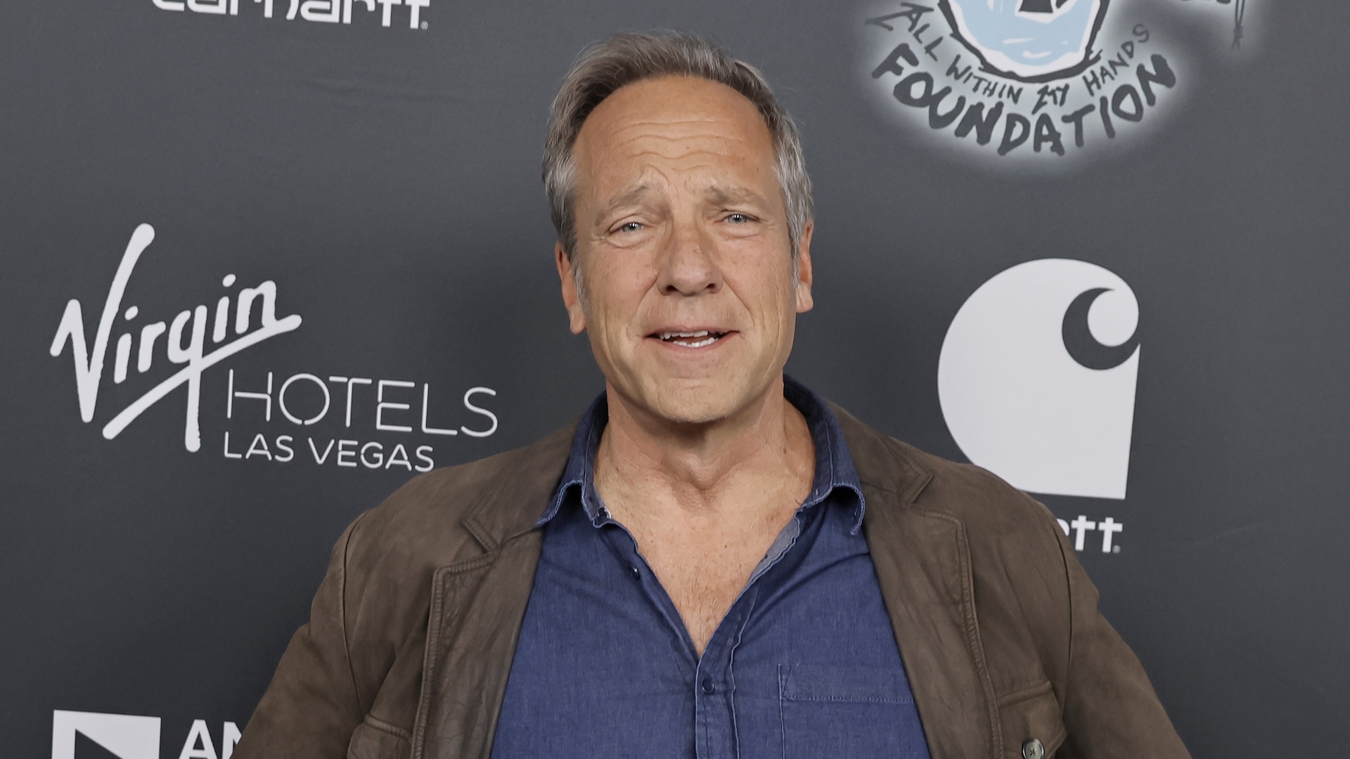 Mike Rowe attending industry event.