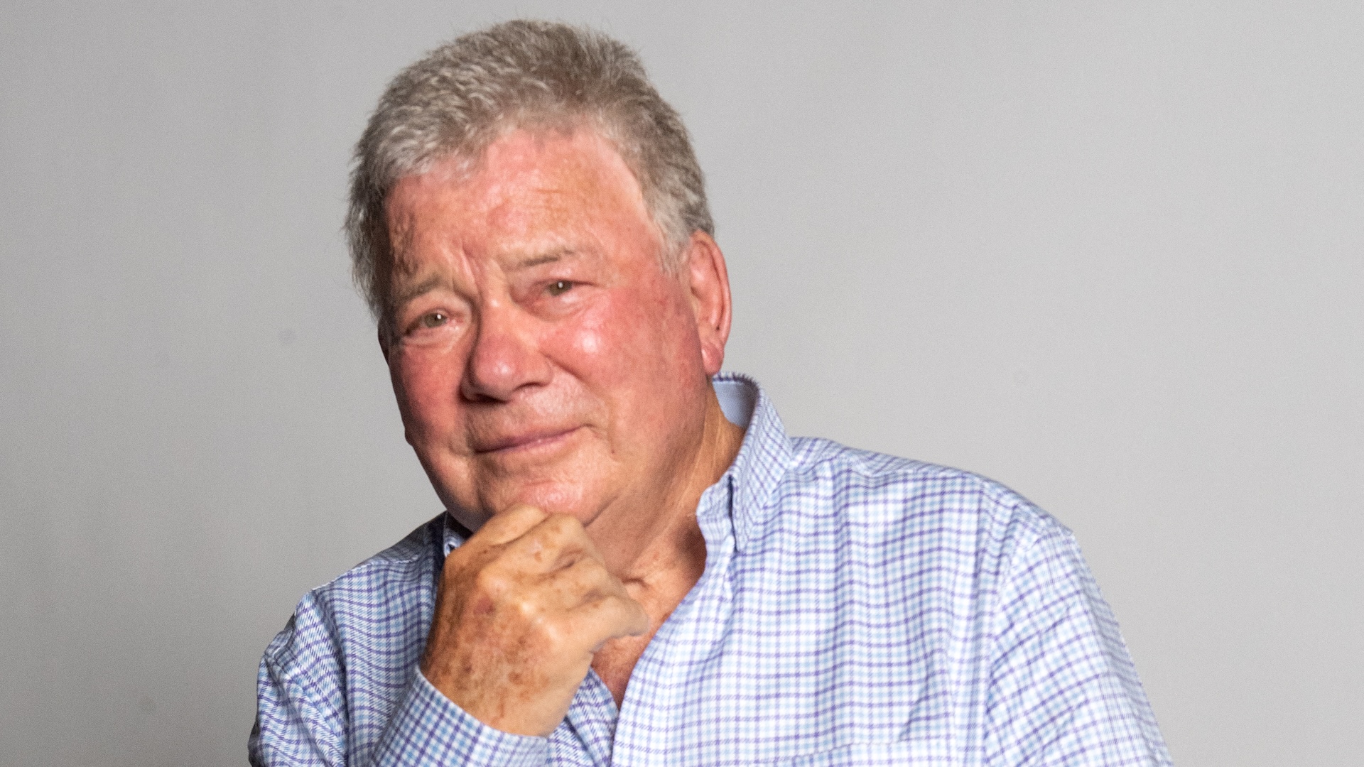 William Shatner posing for a portrait.