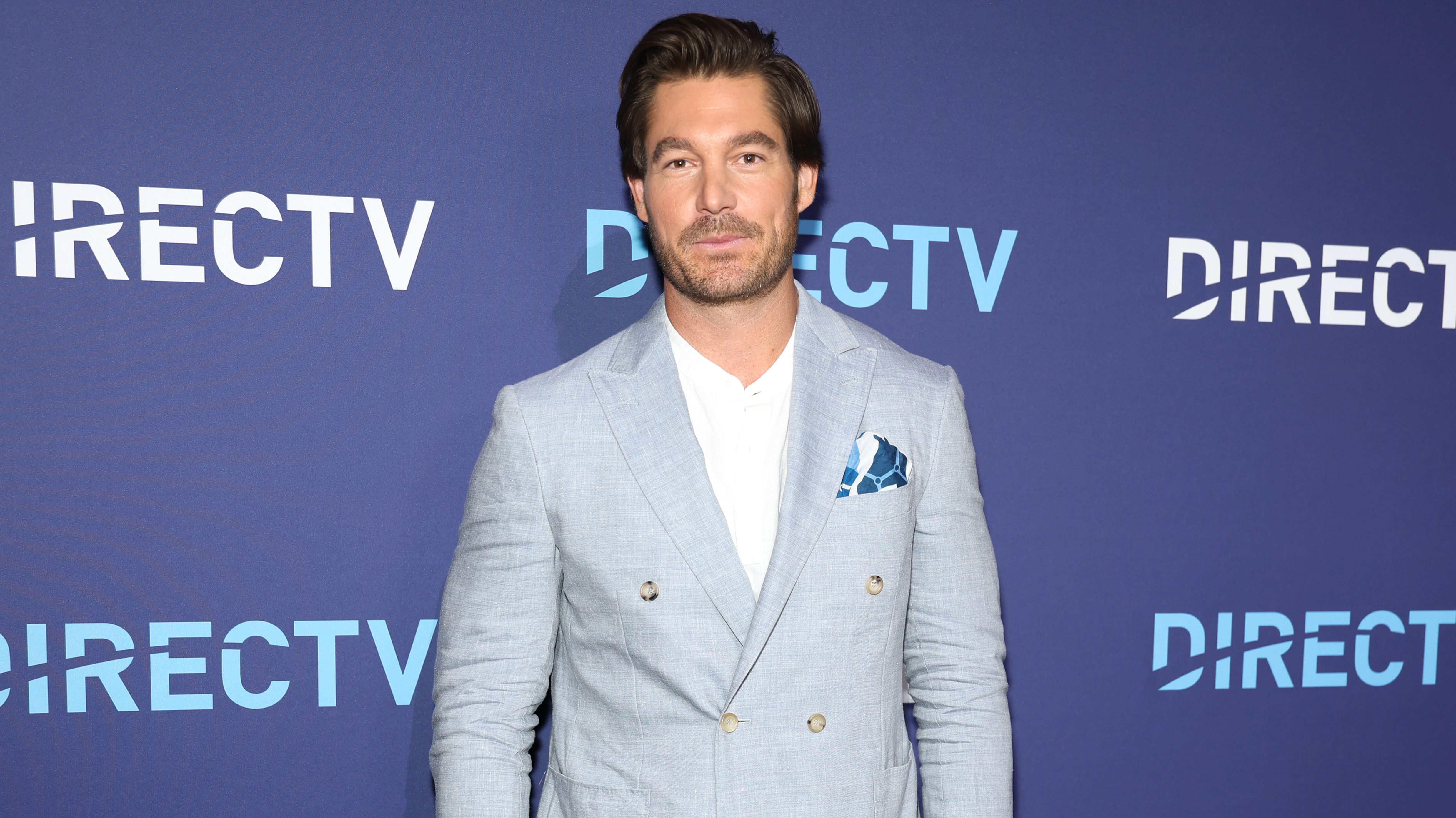 Craig Conover poses on the blue carpet at the DIRECTV Plot Twist Featuring Bravo event in New York City.