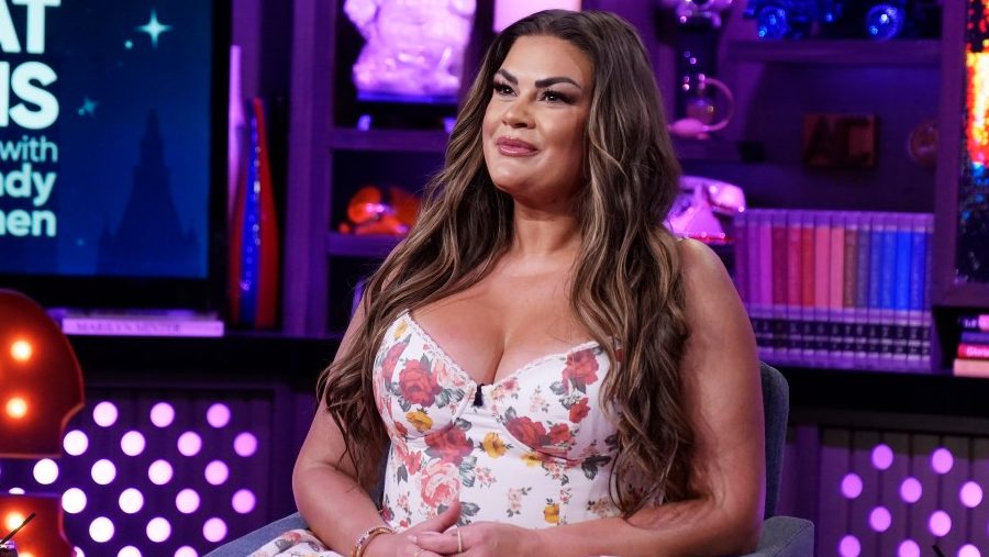 Brittany Cartwright appears on Watch What Happens Live with Andy Cohen wearing a floral dress.