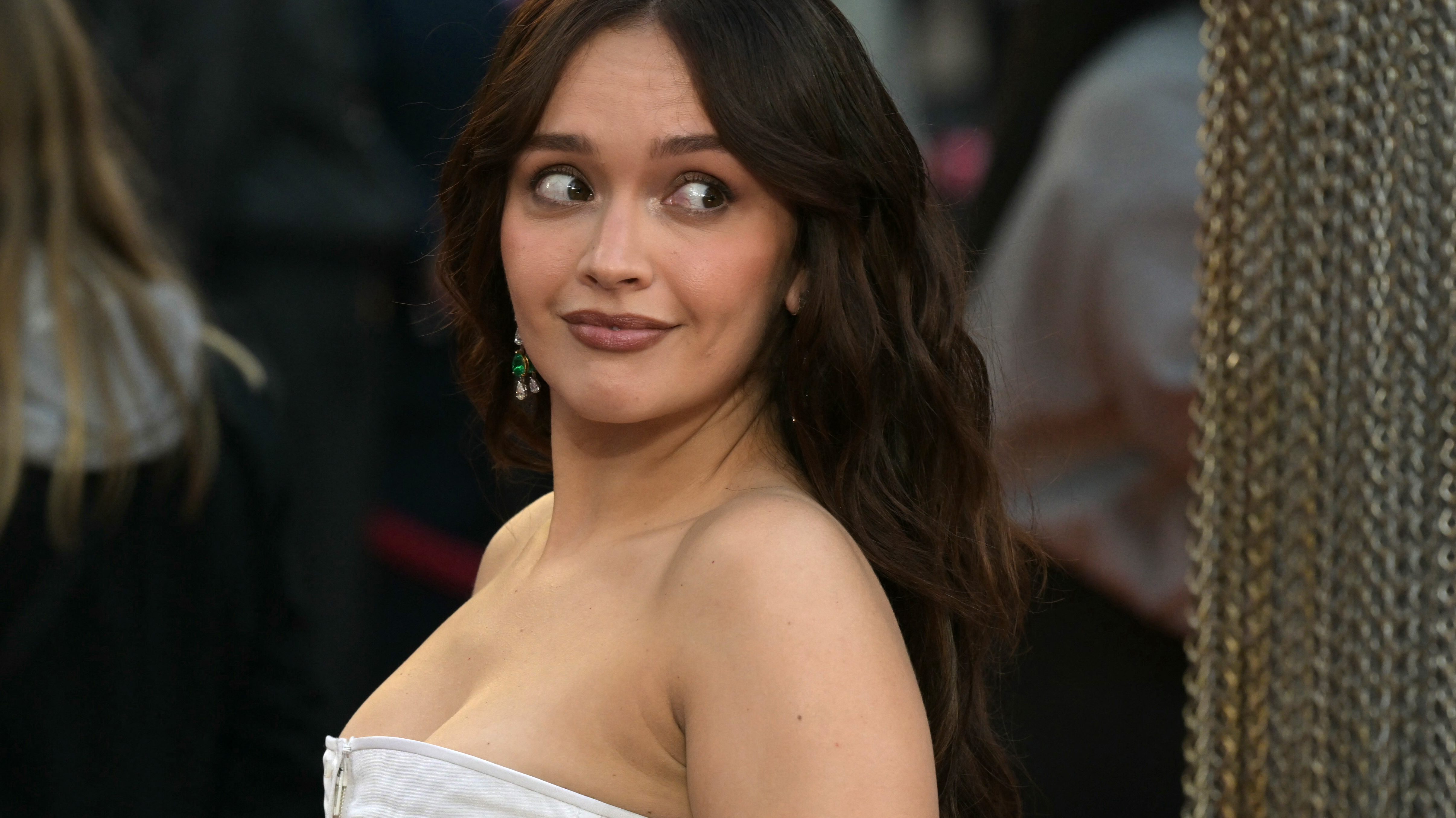 Olivia Cooke wearing a white gown at the premiere of House of the Dragon Season 3
