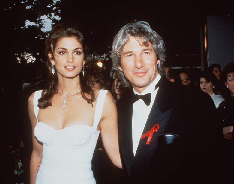 Cindy Crawford and Richard Gere pose together on a red carpet