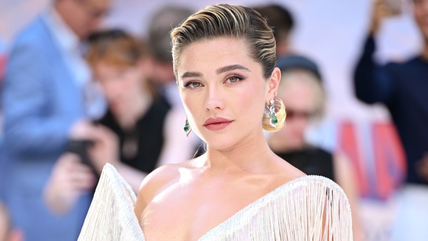 Florence Pugh poses on the red carpet