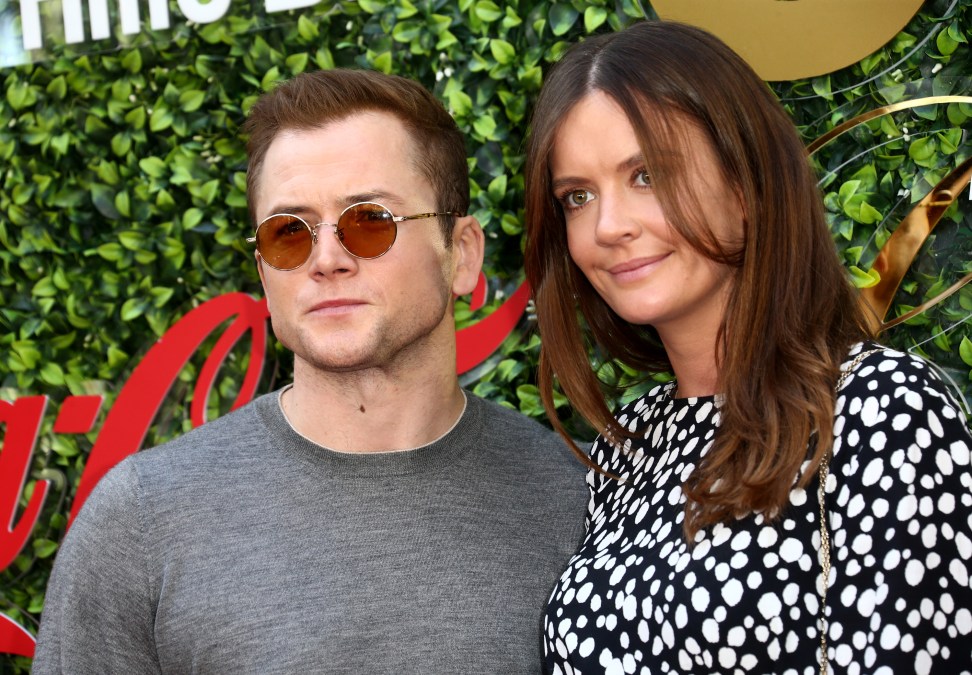 Taron Egerton and Emily Thomas attend the 7th Annual Gold Meets Golden at Virginia Robinson Gardens and Estate on January 04, 2020 in Los Angeles, California. 