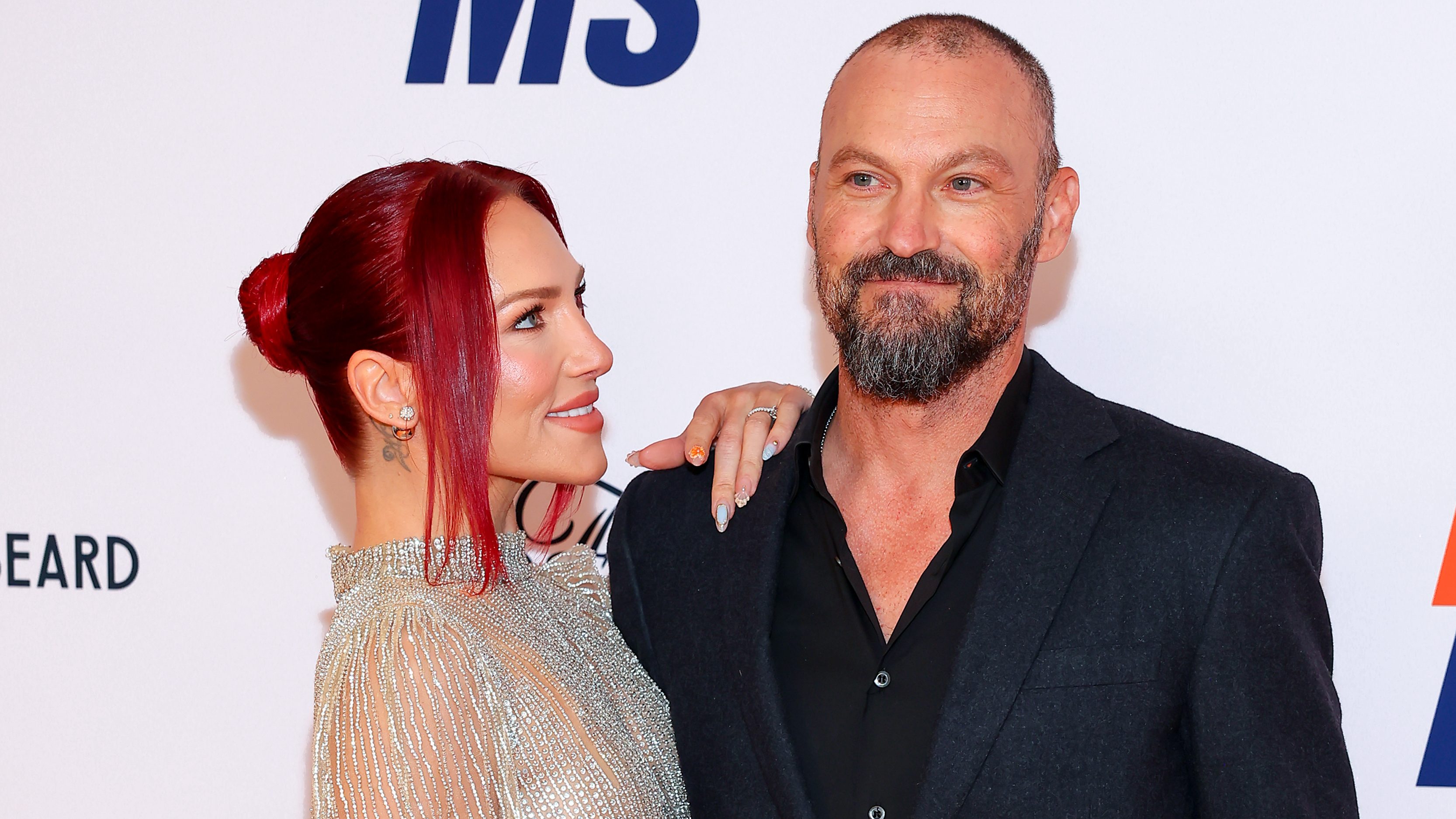 Sharna Burgess dished on what it was like to work with her now-fiance Brian Austin Green on "Dancing With The Stars" season 30 despite dating for less than a year before they were on the show together.