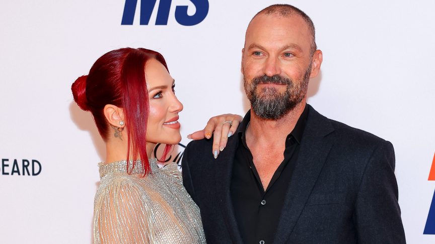 Sharna Burgess dished on what it was like to work with her now-fiance Brian Austin Green on "Dancing With The Stars" season 30 despite dating for less than a year before they were on the show together.