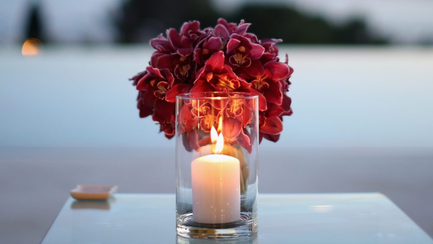 Flowers and a candle for Joan Blackman.