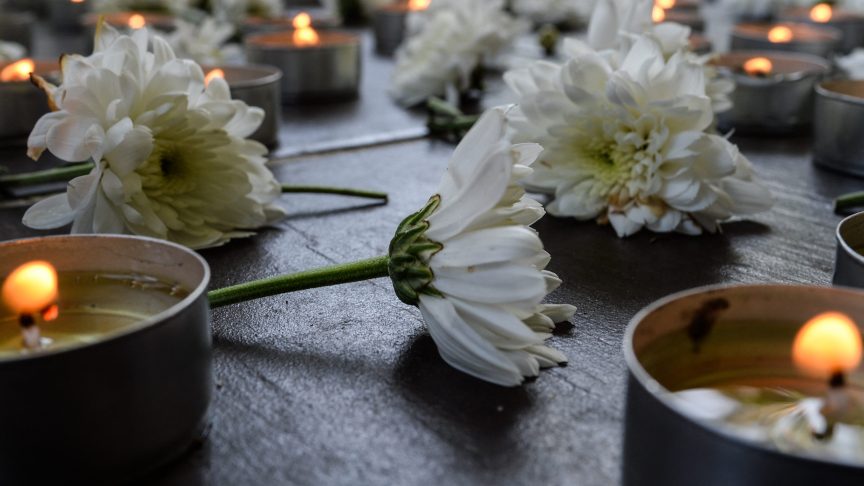Flowers and candles for Lloyd Robertson.