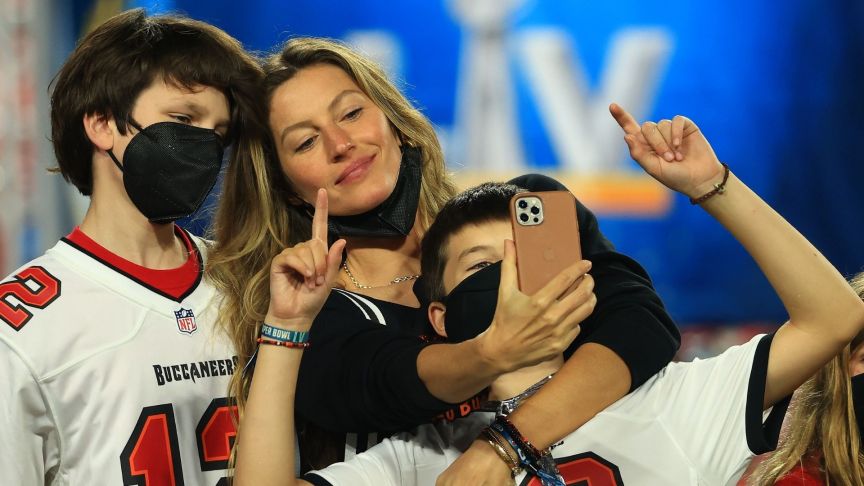 Gisele Bundchen celebrates with John Moynahan and Benjamin Brady after the Buccaneers defeated the Kansas City Chiefs in Super Bowl LV at Raymond James Stadium on February 07, 2021 in Tampa, Florida