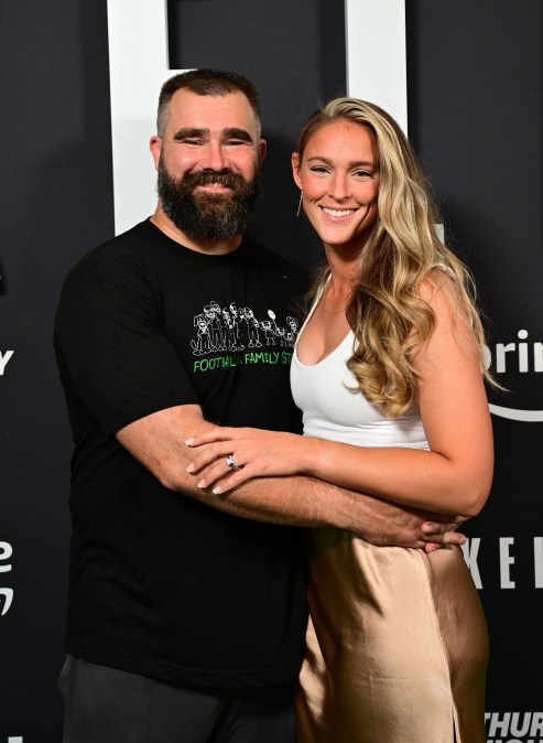 Jason and Kylie Kelce wrapping their arms around each other.