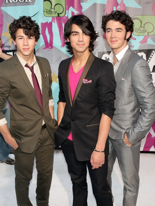 A photo showing the Jonas brothers at a "Camp Rock" event.