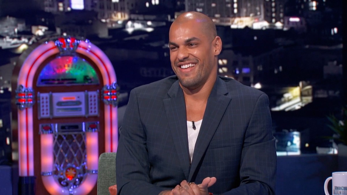 Josh Martinez smiles as he sits on the BB Unlocked set.