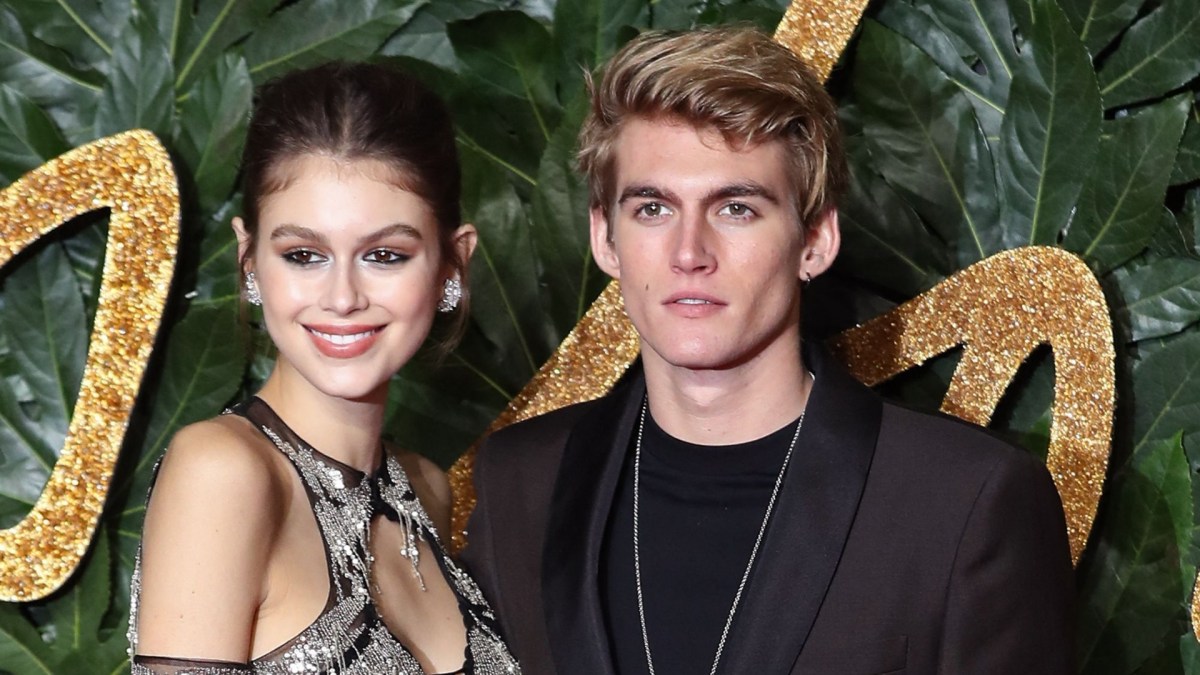 Kaia Gerber smiles next to Presley Gerber