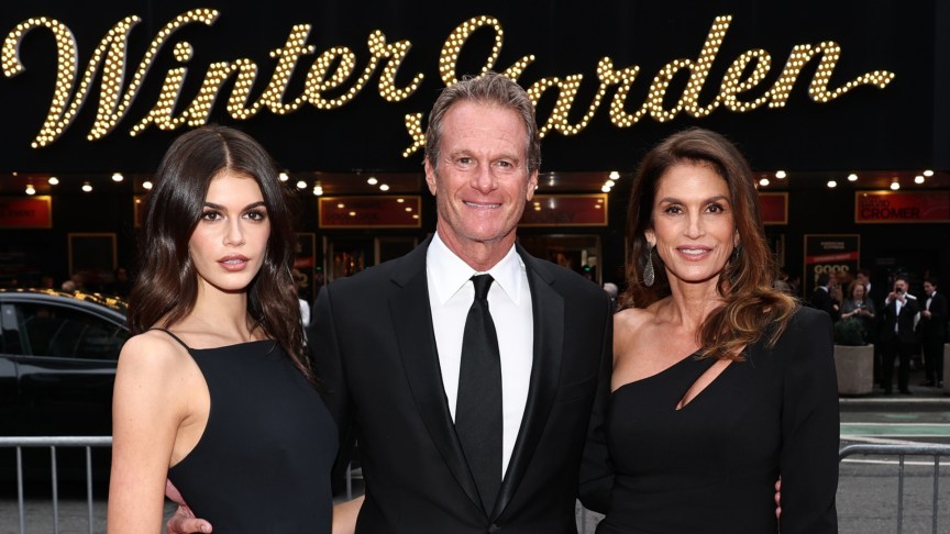 Kaia Gerber, Rande Gerber and Cindy Crawford pose in black in front of the Winter Garden.