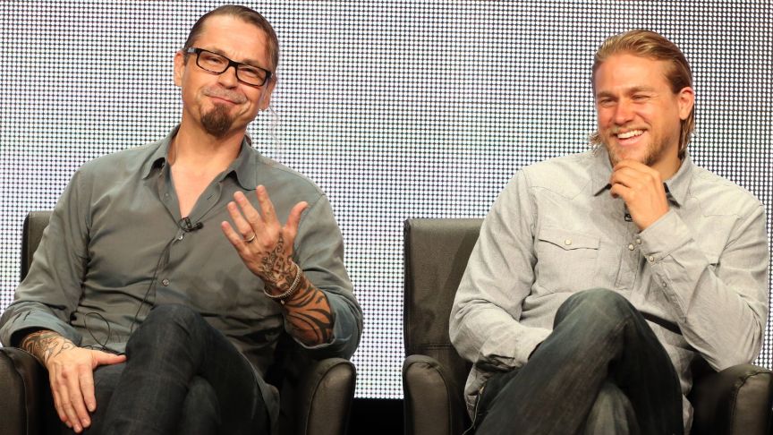 Creator/Executive Producer Kurt Sutter and actor Charlie Hunnam speak onstage during the "Sons of Anarchy" panel discussion at the FX portion of the 2013 Summer Television Critics Association tour - Day 10 at The Beverly Hilton Hotel on August 2, 2013 in Beverly Hills, California