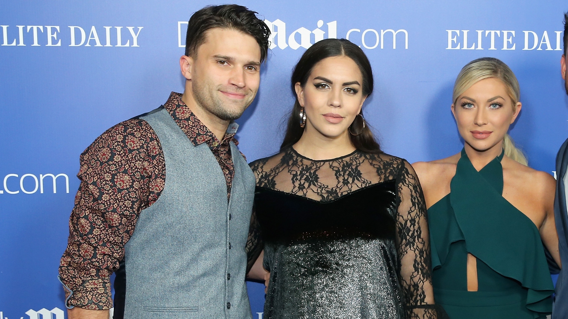 Tom Schwartz, Katie Maloney, and Stassi Schroeder Clark pose for a picture on a red carpet.