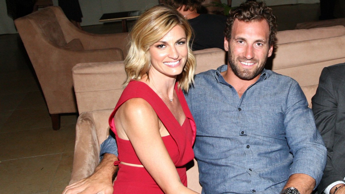 Erin Andrews sits next to Jarret Stoll indoors.