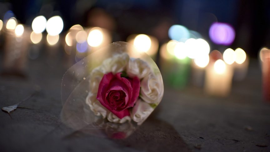 A flower and candles for Richard O'Sullivan.