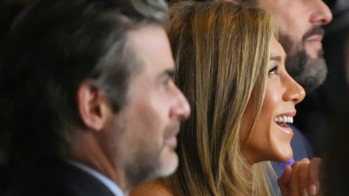 Jim Curtis and Jennifer Aniston attend an event