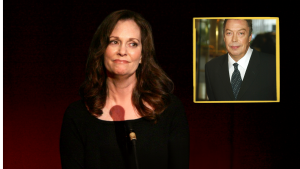 Lesley Ann Warren stands on stage in a black dress. She looks to left and there is a picture of Tim Curry.
