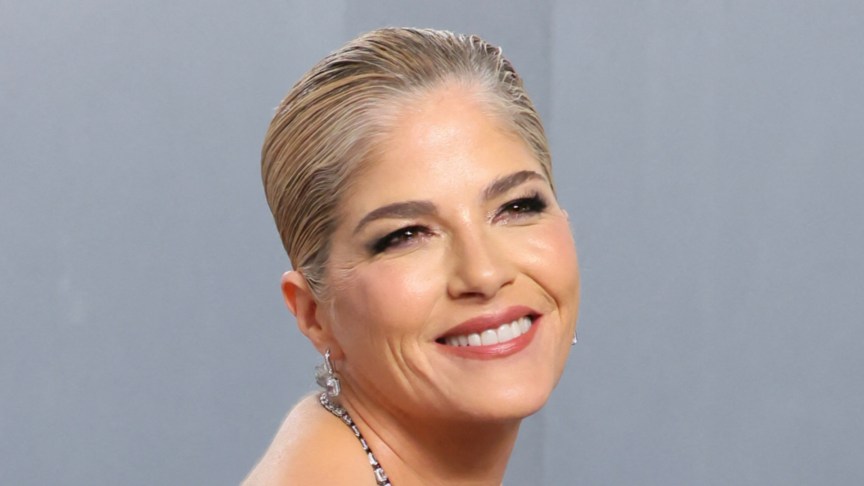 Selma Blair smiles on the red carpet of an event