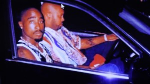 Tupac Shakur in a car with Suge Knight