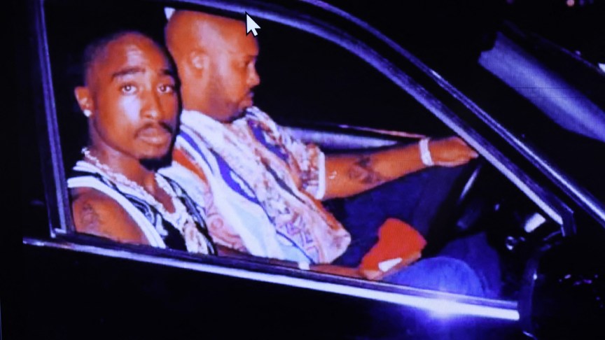 Tupac Shakur in a car with Suge Knight