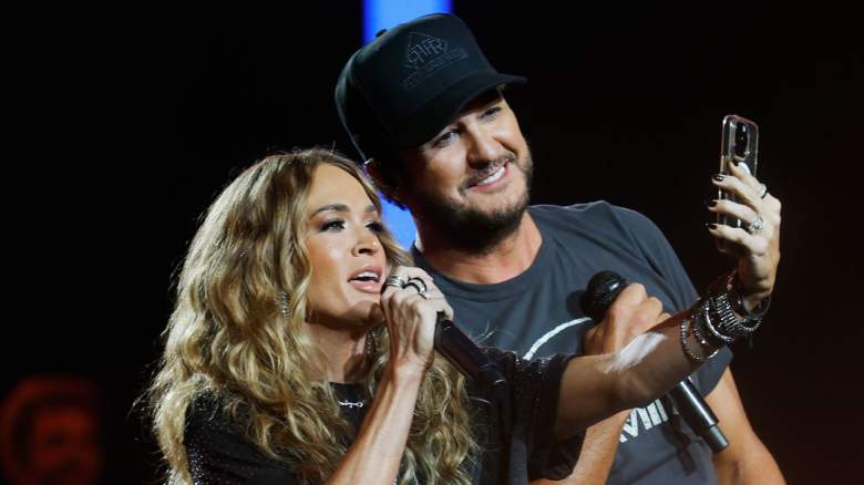 Luke Bryan brings fellow "American idol" judge out on stage to sing Bon Jovi