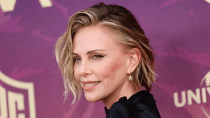 Charlize Theron, 51, Shows Off Her Statuesque Bare Legs In a Tassel Dress Split Up to Her Hips