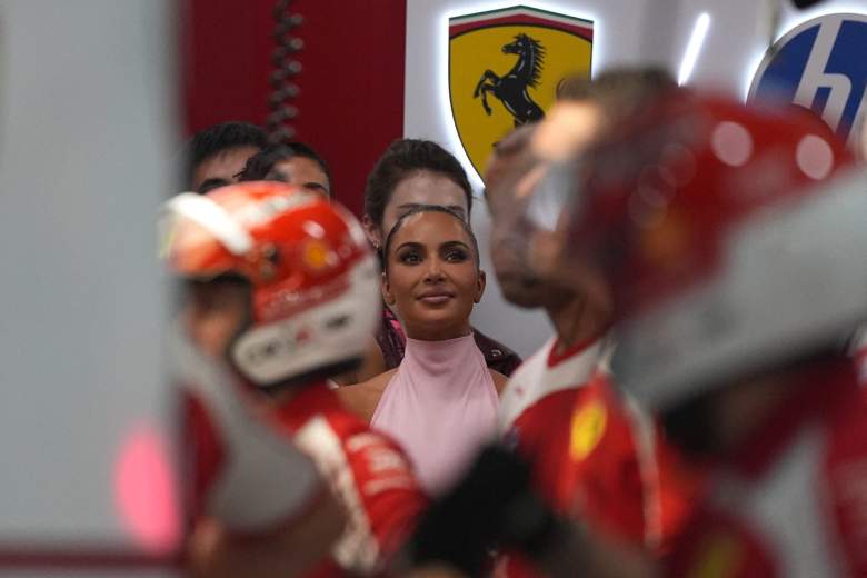 Kim Kardashian (C) looks on during the qualifying session ahead of the Formula One Singapore Grand Prix at the Marina Bay Street Circuit in Singapore on October 10, 2026.