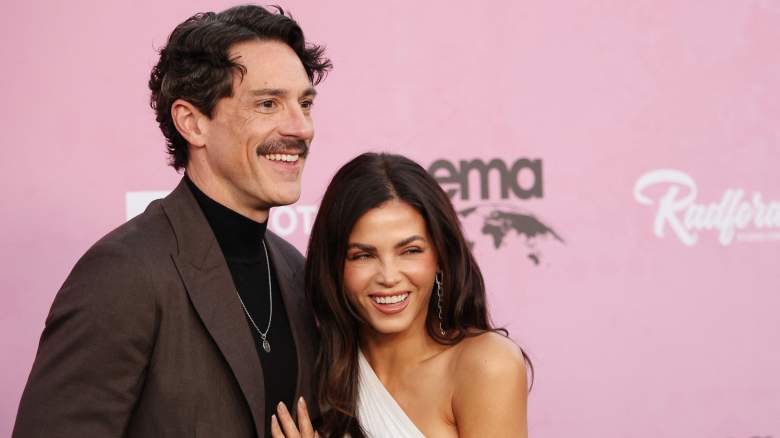 Jenna Dewan laughs with a hand on Steve Kazee's chest.