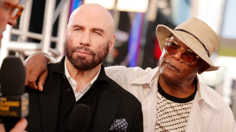 Samuel L. Jackson has his arm around John Travolta's shoulders.